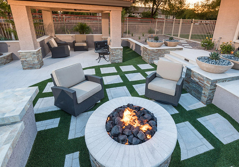 Arizona residential paver patio with artificial turf and outdoor hardscape improvements